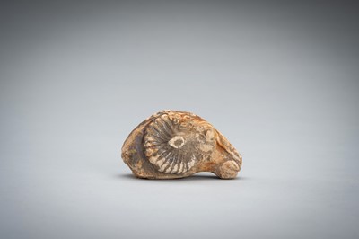 Lot 1422 - A SMALL BACTRIAN STONE CARVING OF A GOAT HEAD