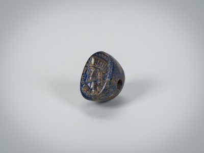 Lot 1343 - A BACTRIAN LAPIS LAZULI INTAGLIO SEAL WITH A PORTRAIT, c. 2ND CENTURY BC
