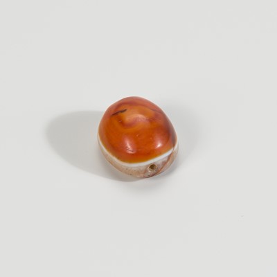 Lot 1528 - A TIBETAN AGATE BUDDHA EYE BEAD, 19TH CENTURY OR EARLIER