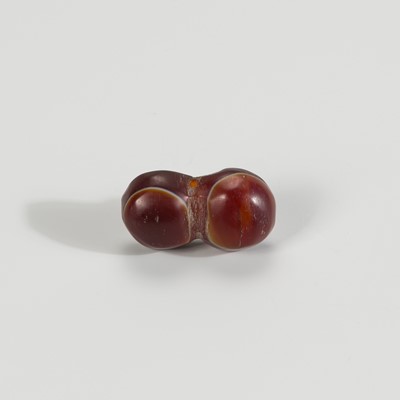 Lot 1535 - A TIBETAN AGATE BUDDHA EYE BEAD, 19TH CENTURY OR EARLIER