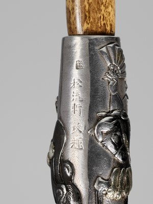 Lot 71 - SHORYUKEN MASATERU: A FINE AND LARGE SILVER AND BAMBOO KISERU (PIPE) DEPICTING THE BATTLE OF UJI