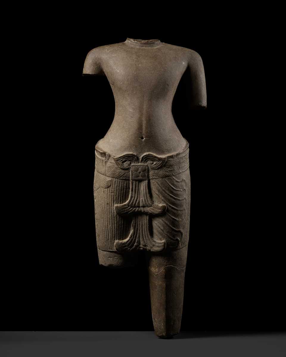 Lot 347 - A SANDSTONE TORSO OF A MALE DEITY, KHMER, ANGKOR PERIOD