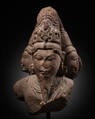 Lot 271 - A PINK SANDSTONE HEAD OF BRAHMA TRIMURTI, CENTRAL INDIA, POST-GUPTA PERIOD, 7TH CENTURY