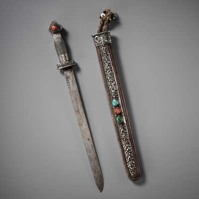 Lot 8 - AN IRON AND SILVER REPOUSSÉ CEREMONIAL SWORD AND SCABBARD