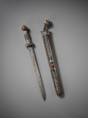 Lot 8 - AN IRON AND SILVER REPOUSSÉ CEREMONIAL SWORD AND SCABBARD