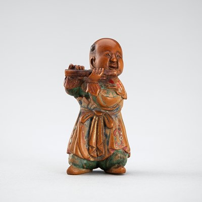 Lot 529 - A POLYCHROME WOOD NETSUKE OF A KARAKO PLAYING THE FLUTE