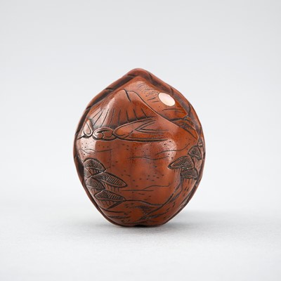 Lot 632 - AN INLAID KURUMI (WALNUT) NETSUKE WITH MOUNT FUJI