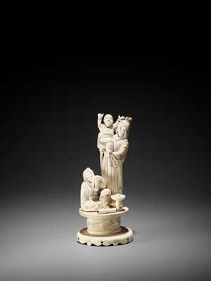 Lot 174 - A MOTHER OF PEARL-INLAID IVORY OKIMONO OF A BIJIN WITH TWO CHILDREN