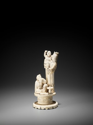 Lot 174 - A MOTHER OF PEARL-INLAID IVORY OKIMONO OF A BIJIN WITH TWO CHILDREN