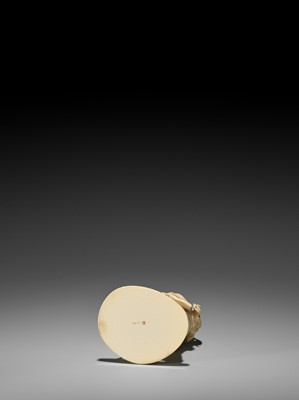 Lot 166 - GOSHIN: AN IVORY OKIMONO OF A BIJIN SIFTING GRAINS