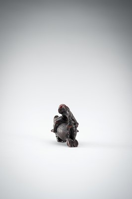 Lot 547 - SHURAKU: A WOOD NETSUKE OF NITTA NO SHIRO RIDING A WILD BOAR