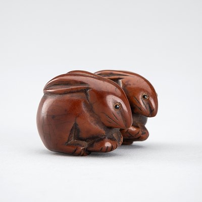 Lot 1187 - A COROZO NUT NETSUKE OF TWO RABBITS