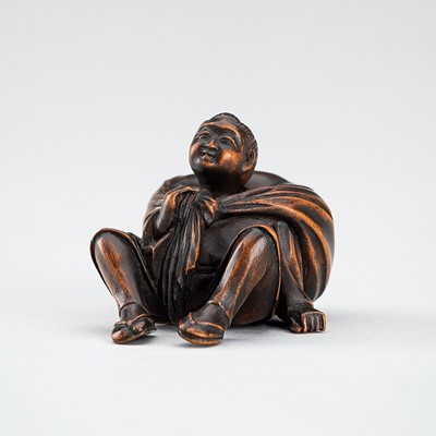 Lot 548 - A RARE WOOD NETSUKE OF A BOY WITH SACK