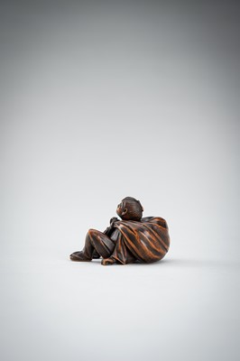 Lot 548 - A RARE WOOD NETSUKE OF A BOY WITH SACK