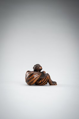 Lot 548 - A RARE WOOD NETSUKE OF A BOY WITH SACK