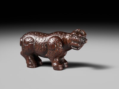 Lot 285 - OUCHI SOSUI: A FINE SO SCHOOL WOOD NETSUKE OF AN ARCHAIC CHINESE BRONZE BUFFALO