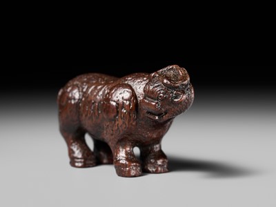 Lot 285 - OUCHI SOSUI: A FINE SO SCHOOL WOOD NETSUKE OF AN ARCHAIC CHINESE BRONZE BUFFALO