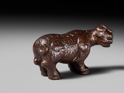 Lot 285 - OUCHI SOSUI: A FINE SO SCHOOL WOOD NETSUKE OF AN ARCHAIC CHINESE BRONZE BUFFALO