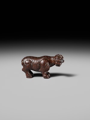 Lot 285 - OUCHI SOSUI: A FINE SO SCHOOL WOOD NETSUKE OF AN ARCHAIC CHINESE BRONZE BUFFALO