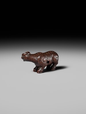 Lot 285 - OUCHI SOSUI: A FINE SO SCHOOL WOOD NETSUKE OF AN ARCHAIC CHINESE BRONZE BUFFALO