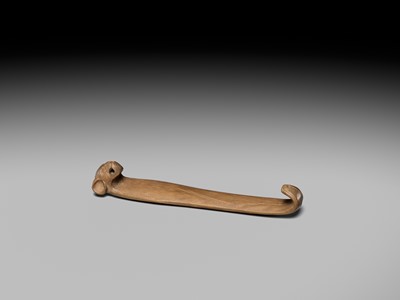 Lot 437 - KYOKUTEI: AN UNUSUAL SO-SCHOOL WOOD OBI-HASAMI NETSUKE OF A STYLIZED BAT