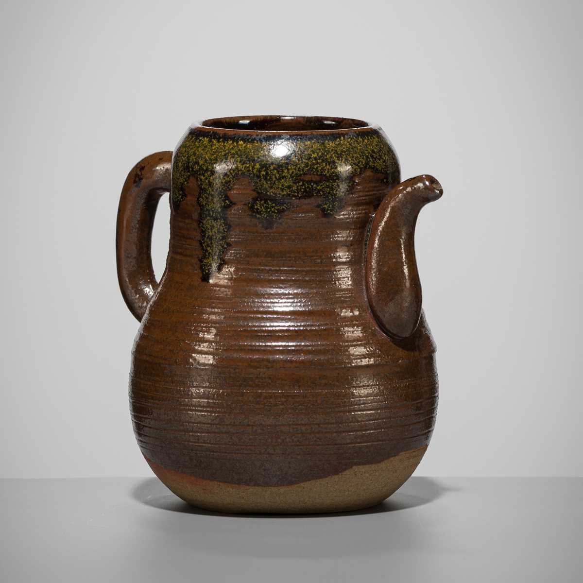 Lot 180 - A TAKATORI TEADUST-SPLASHED BROWN-GLAZED TEAPOT-FORM CHAIRE (TEA CADDY)