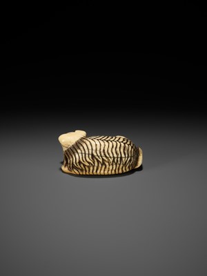 Lot 56 - A RARE IVORY NETSUKE OF A JAKONEKO (MUSK CAT)