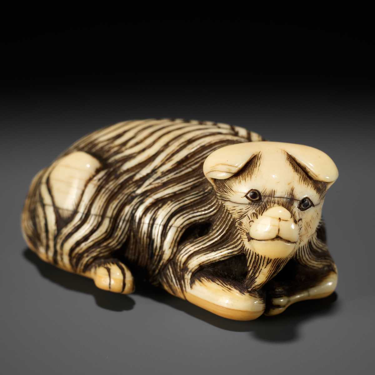 Lot 56 - A RARE IVORY NETSUKE OF A JAKONEKO (MUSK CAT)