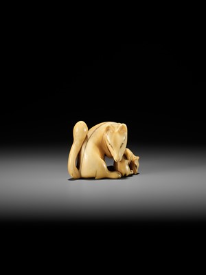 Lot 60 - A RARE IVORY NETSUKE OF A KITSUNE (FOX) AND CUB