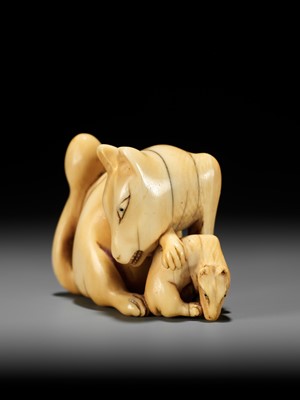 Lot 60 - A RARE IVORY NETSUKE OF A KITSUNE (FOX) AND CUB