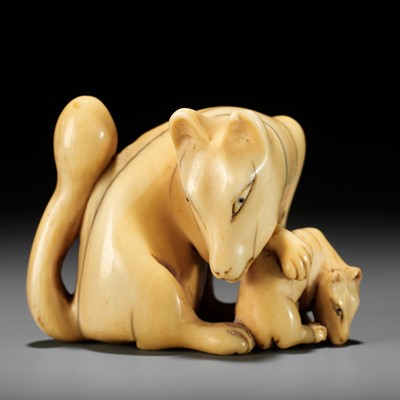 Lot 60 - A RARE IVORY NETSUKE OF A KITSUNE (FOX) AND CUB