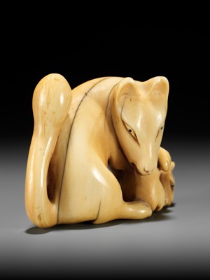 Lot 60 - A RARE IVORY NETSUKE OF A KITSUNE (FOX) AND CUB