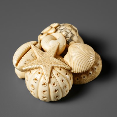 Lot 497 - GYOKUHOSAI RYUCHIN: AN IVORY NETSUKE OF A MYRIAD OF SHELLS