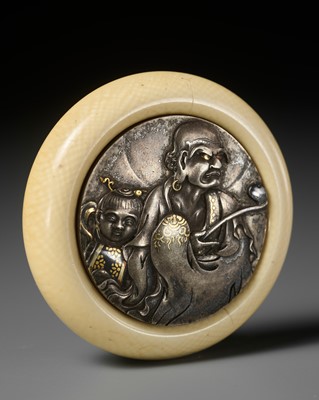 Lot 509 - SHOKASAI MINKOKU: AN IVORY AND SHIBUICHI KAGAMIBUTA NETSUKE WITH RAKAN AND ATTENDANT