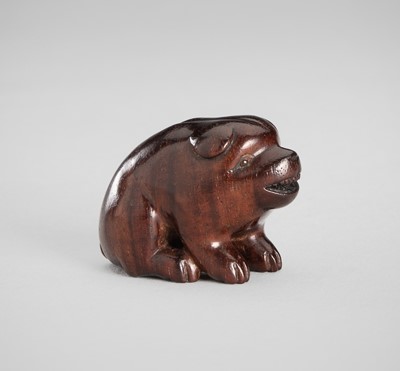 Lot 1517 - RANICHI: A WOOD NETSUKE OF A PUPPY