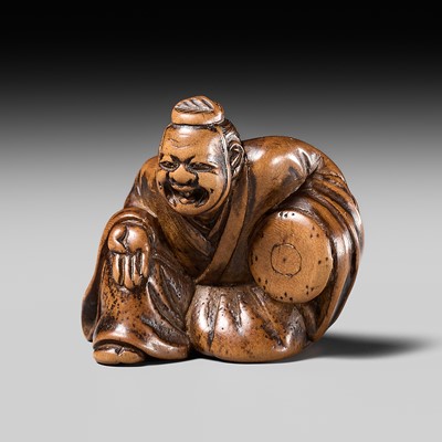 Lot 234 - HOJITSU: A FINE WOOD NETSUKE OF A MANZAI DANCER