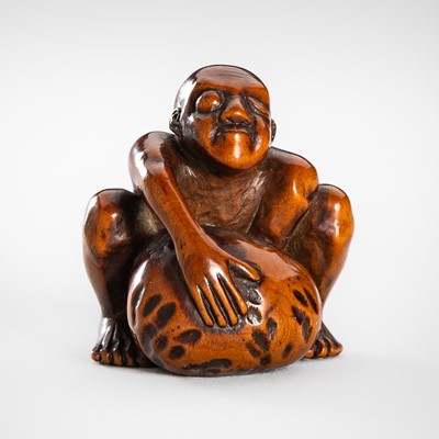 Lot 1658 - SANCHO: A FINE WOOD NETSUKE OF A BLIND STONE LIFTER