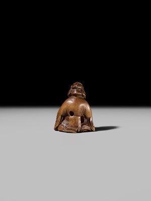Lot 409 - ONO SHORAKU: A WOOD SHUNGA NETSUKE OF OKAME AND TENGU MASK