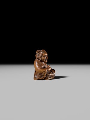 Lot 409 - ONO SHORAKU: A WOOD SHUNGA NETSUKE OF OKAME AND TENGU MASK