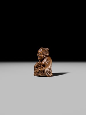 Lot 409 - ONO SHORAKU: A WOOD SHUNGA NETSUKE OF OKAME AND TENGU MASK