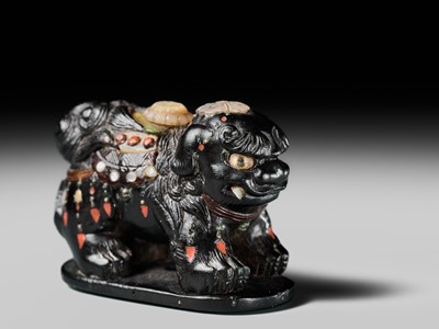 Lot 263 - SHIBAYAMA: A FINE INLAID EBONY WOOD NETSUKE OF A CAPARISONED SHISHI