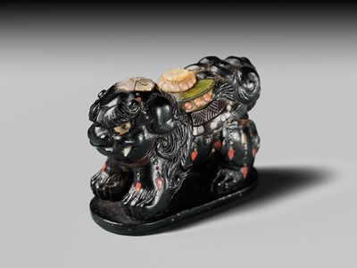 Lot 263 - SHIBAYAMA: A FINE INLAID EBONY WOOD NETSUKE OF A CAPARISONED SHISHI