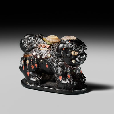 Lot 263 - SHIBAYAMA: A FINE INLAID EBONY WOOD NETSUKE OF A CAPARISONED SHISHI