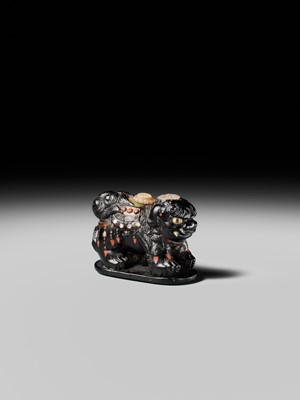Lot 263 - SHIBAYAMA: A FINE INLAID EBONY WOOD NETSUKE OF A CAPARISONED SHISHI