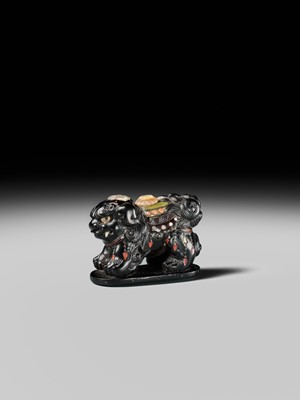 Lot 263 - SHIBAYAMA: A FINE INLAID EBONY WOOD NETSUKE OF A CAPARISONED SHISHI