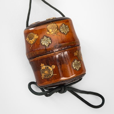 Lot 1440 - KOMA KANSAI AND RYUKEI II: A MINIATURE BAMBOO INRO WITH KIKU AND KIRI EMBLEMS