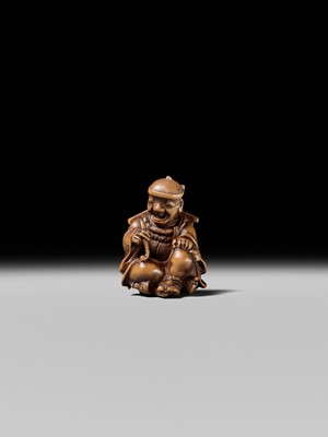 Lot 231 - AN AMUSING WOOD KARAKURI (TRICK) NETSUKE OF A MASK SELLER