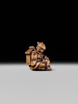 Lot 231 - AN AMUSING WOOD KARAKURI (TRICK) NETSUKE OF A MASK SELLER