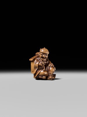 Lot 231 - AN AMUSING WOOD KARAKURI (TRICK) NETSUKE OF A MASK SELLER