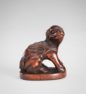 Lot 1595 - A WOOD NETSUKE OF A KIRIN
